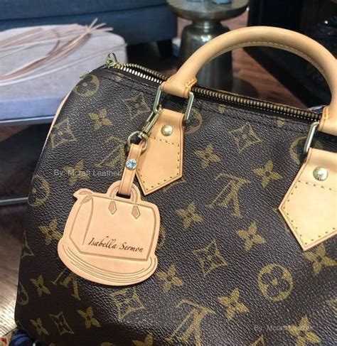 does lv stores engrave purses.